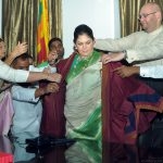 Assisted by family and well-wishers, Colombo’s first woman Mayor Rosy Senanayake dons the Mayoral Robe as she prepares to take office at the Colombo Municipal Council on March 22, 2018.  Photo, courtesy www.CeylonToday.lk
