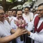 Three musketeers- Mahinda, Gotabhaya and Basil at their party office. Behind them there are hundreds of relatives who want another chance to loot the country.
