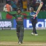 Bangladesh captain raises the bat after scoring a century.  Even after that defeat, Lankan fans were optimistic.