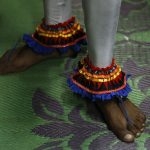 A traditional dancer’s decorated feet is seen as he waiting for his part during a Gara demon ceremony  in Kottawa about 20 km from Colombo